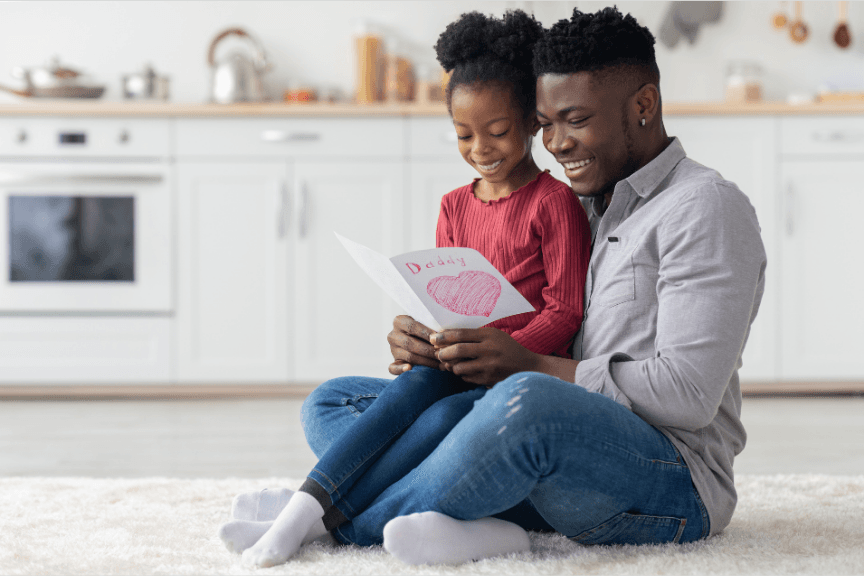 A dad and daughter sharing a quiet moment at home